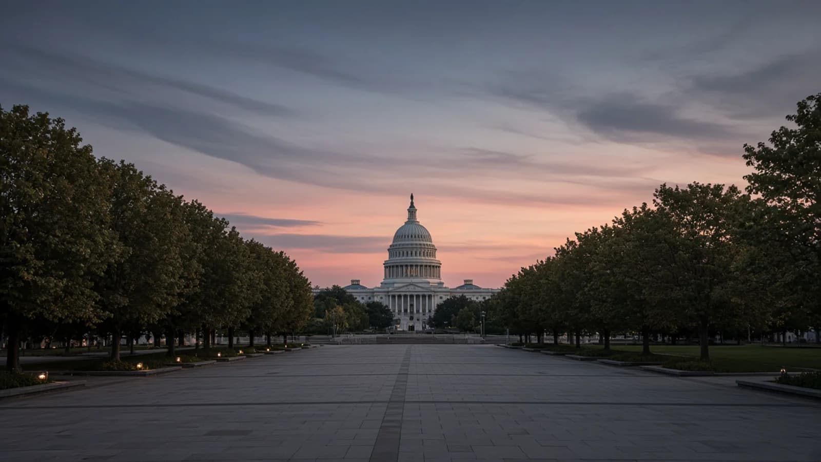 Broad tree-lined civic avenue at dusk