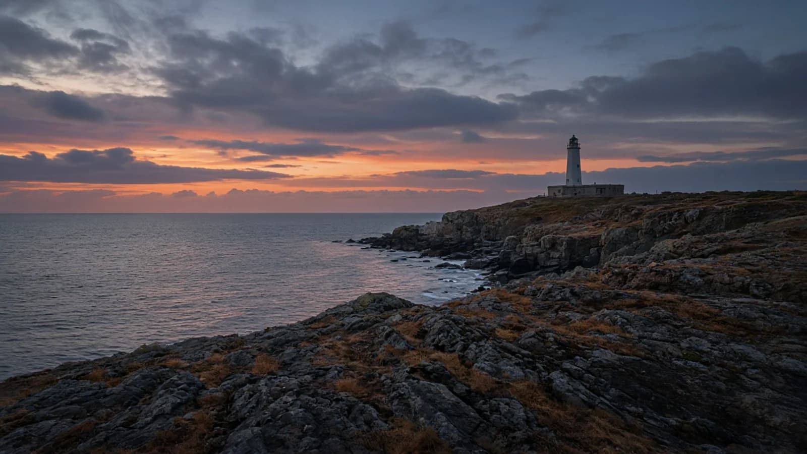 Coastal promenade above the water at sunset