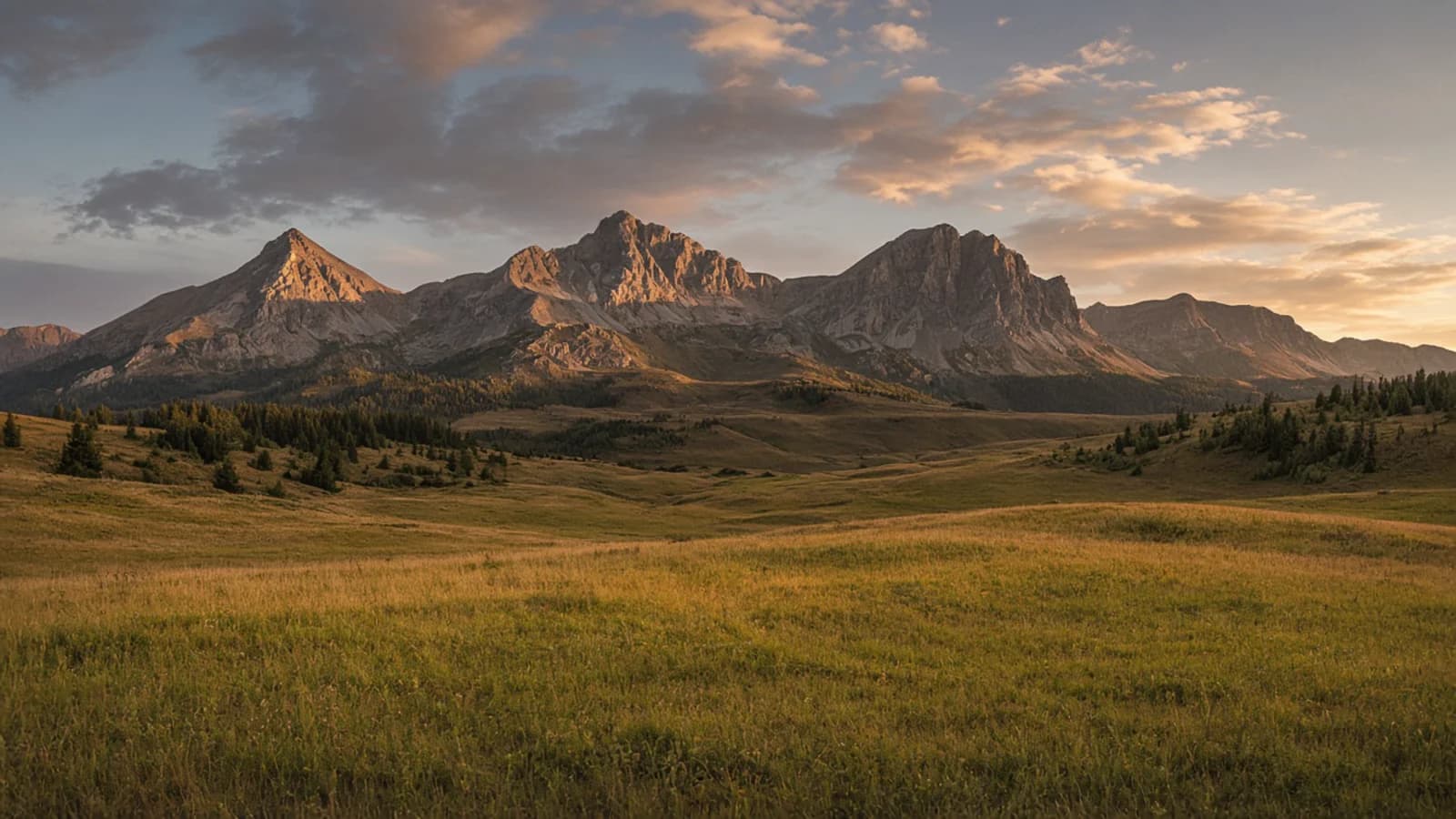 Mountain valley road and ridges at golden hour