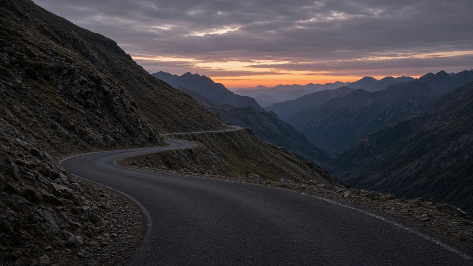 Mountain valley road and ridges at golden hour